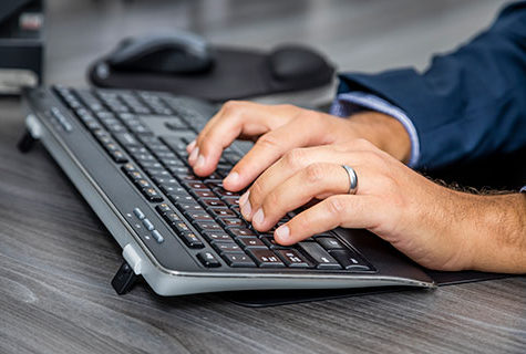 Employee typing on keyboard