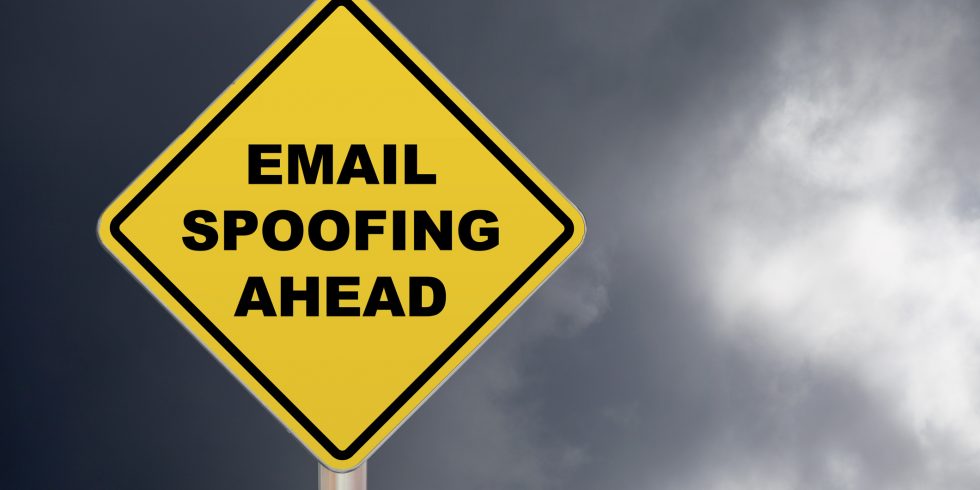 Crossing sign that reads email spoofing ahead