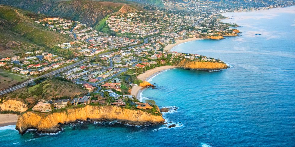 Wide angle aerial view of the homes along the beautiful coastal cliffs of Laguna Beach, California.